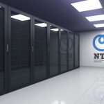 Modern data center interior featuring rows of black server racks and a large NTT (Nippon Telegraph and Telephone Corporation) logo on a white wall.